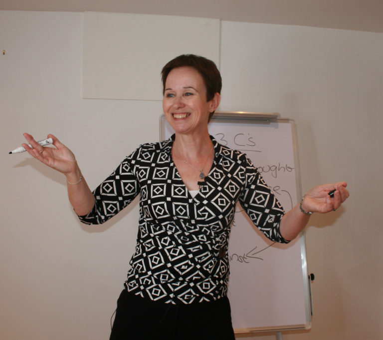 Tutor in front of a whiteboard